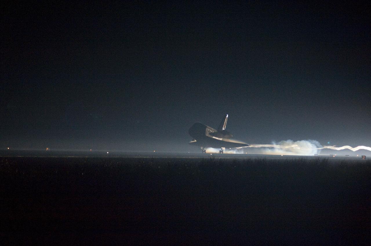 STS135-S-222 (21 July 2011) --- Ribbons of steam and smoke trail space shuttle Atlantis as it touches down on the Shuttle Landing Facility's Runway 15 at NASA's Kennedy Space Center in Florida for the final time. Securing the space shuttle fleet's place in history, Atlantis marked the 26th nighttime landing of NASA's Space Shuttle Program and the 78th landing at Kennedy. Main gear touchdown was at 5:57:00 a.m. (EDT) on July 21, 2011, followed by nose gear touchdown at 5:57:20 a.m., and wheelstop at 5:57:54 a.m. Onboard are NASA astronauts Chris Ferguson, STS-135 commander; Doug Hurley, pilot; Sandy Magnus and Rex Walheim, both mission specialists. On the 37th shuttle mission to the International Space Station, STS-135 delivered more than 9,400 pounds of spare parts, equipment and supplies in the Raffaello multi-purpose logistics module that will sustain station operations for the next year. STS-135 was the 33rd and final flight for Atlantis, which has spent 307 days in space, orbited Earth 4,848 times and traveled 125,935,769 miles. Photo credit: NASA