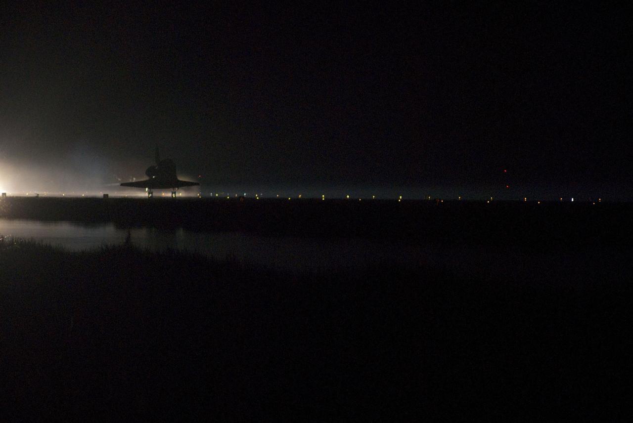 STS135-S-227 (21 July 2011) --- Enshrouded in darkness, space shuttle Atlantis touches down for the final time on Runway 15 at the Shuttle Landing Facility at NASA's Kennedy Space Center in Florida. Securing the space shuttle fleet's place in history, Atlantis marked the 26th nighttime landing of NASA's Space Shuttle Program and the 78th landing at Kennedy. Main gear touchdown was at 5:57:00 a.m. (EDT) on July 21, 2011, followed by nose gear touchdown at 5:57:20 a.m., and wheelstop at 5:57:54 a.m. Onboard are NASA astronauts Chris Ferguson, STS-135 commander; Doug Hurley, pilot; Sandy Magnus and Rex Walheim, both mission specialists. On the 37th shuttle mission to the International Space Station, STS-135 delivered more than 9,400 pounds of spare parts, equipment and supplies in the Raffaello multi-purpose logistics module that will sustain station operations for the next year. STS-135 was the 33rd and final flight for Atlantis, which has spent 307 days in space, orbited Earth 4,848 times and traveled 125,935,769 miles. Photo credit: NASA