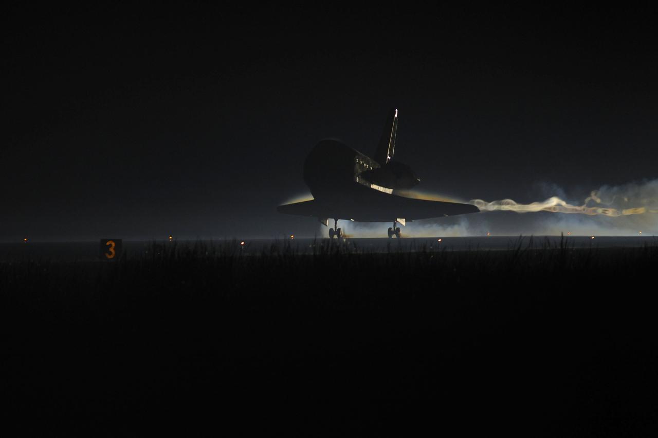 STS135-S-232 (21 July 2011) --- Ribbons of steam and smoke trail space shuttle Atlantis as it touches down on the Shuttle Landing Facility's Runway 15 at NASA's Kennedy Space Center in Florida for the final time. Securing the space shuttle fleet's place in history, Atlantis marked the 26th nighttime landing of NASA's Space Shuttle Program and the 78th landing at Kennedy. Main gear touchdown was at 5:57:00 a.m. (EDT) on July 21, 2011, followed by nose gear touchdown at 5:57:20 a.m., and wheelstop at 5:57:54 a.m. Onboard are NASA astronauts Chris Ferguson, STS-135 commander; Doug Hurley, pilot; Sandy Magnus and Rex Walheim, both mission specialists. On the 37th shuttle mission to the International Space Station, STS-135 delivered more than 9,400 pounds of spare parts, equipment and supplies in the Raffaello multi-purpose logistics module that will sustain station operations for the next year. STS-135 was the 33rd and final flight for Atlantis, which has spent 307 days in space, orbited Earth 4,848 times and traveled 125,935,769 miles. Photo credit: NASA