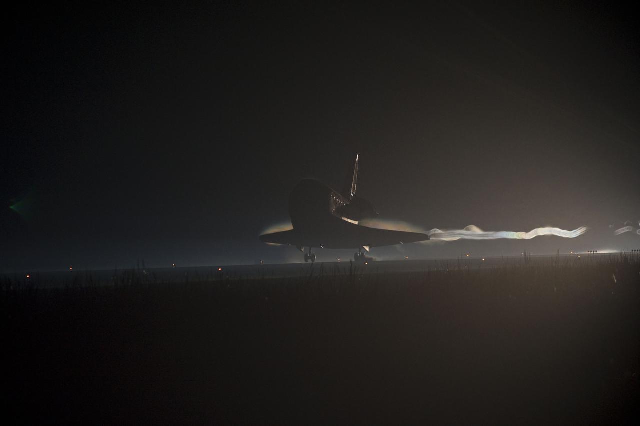 STS135-S-237 (21 July 2011) --- Ribbons of steam and smoke trail space shuttle Atlantis as it touches down on the Shuttle Landing Facility's Runway 15 at NASA's Kennedy Space Center in Florida for the final time. Securing the space shuttle fleet's place in history, Atlantis marked the 26th nighttime landing of NASA's Space Shuttle Program and the 78th landing at Kennedy. Main gear touchdown was at 5:57:00 a.m. (EDT) on July 21, 2011, followed by nose gear touchdown at 5:57:20 a.m., and wheelstop at 5:57:54 a.m. Onboard are NASA astronauts Chris Ferguson, STS-135 commander; Doug Hurley, pilot; Sandy Magnus and Rex Walheim, both mission specialists. On the 37th shuttle mission to the International Space Station, STS-135 delivered more than 9,400 pounds of spare parts, equipment and supplies in the Raffaello multi-purpose logistics module that will sustain station operations for the next year. STS-135 was the 33rd and final flight for Atlantis, which has spent 307 days in space, orbited Earth 4,848 times and traveled 125,935,769 miles. Photo credit: NASA