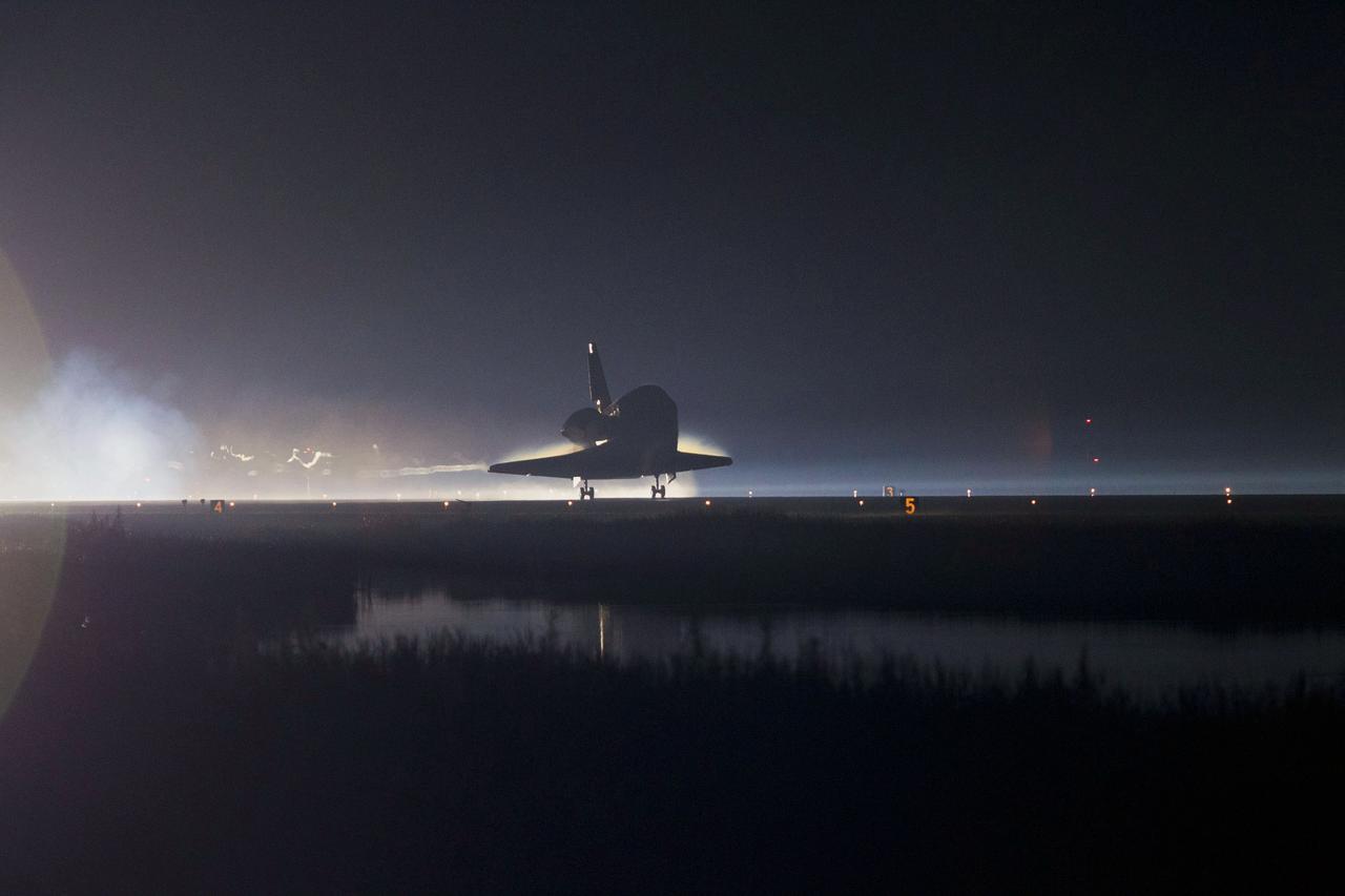 STS135-S-246 (21 July 2011) --- Xenon lights guide space shuttle Atlantis as it lands on the Shuttle Landing Facility's Runway 15 at NASA's Kennedy Space Center in Florida for the final time. Securing the space shuttle fleet's place in history, Atlantis marked the 26th nighttime landing of NASA's Space Shuttle Program and the 78th landing at Kennedy. Main gear touchdown was at 5:57:00 a.m. (EDT) on July 21, 2011, followed by nose gear touchdown at 5:57:20 a.m., and wheelstop at 5:57:54 a.m. Onboard are NASA astronauts Chris Ferguson, STS-135 commander; Doug Hurley, pilot; Sandy Magnus and Rex Walheim, both mission specialists. On the 37th shuttle mission to the International Space Station, STS-135 delivered more than 9,400 pounds of spare parts, equipment and supplies in the Raffaello multi-purpose logistics module that will sustain station operations for the next year. STS-135 was the 33rd and final flight for Atlantis, which has spent 307 days in space, orbited Earth 4,848 times and traveled 125,935,769 miles. Photo credit: NASA