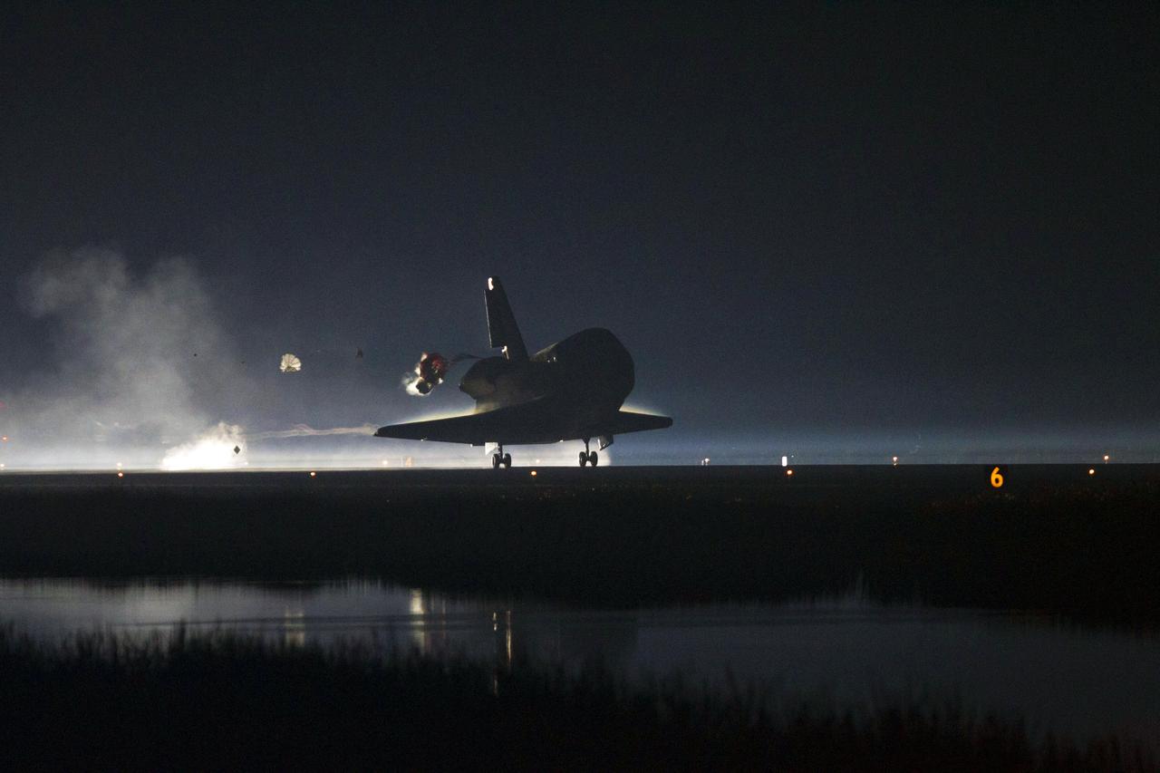 STS135-S-250 (21 July 2011) --- Xenon lights guide space shuttle Atlantis as it lands on the Shuttle Landing Facility's Runway 15 at NASA's Kennedy Space Center in Florida for the final time. Securing the space shuttle fleet's place in history, Atlantis marked the 26th nighttime landing of NASA's Space Shuttle Program and the 78th landing at Kennedy. Main gear touchdown was at 5:57:00 a.m. (EDT) on July 21, 2011, followed by nose gear touchdown at 5:57:20 a.m., and wheelstop at 5:57:54 a.m. Onboard are NASA astronauts Chris Ferguson, STS-135 commander; Doug Hurley, pilot; Sandy Magnus and Rex Walheim, both mission specialists. On the 37th shuttle mission to the International Space Station, STS-135 delivered more than 9,400 pounds of spare parts, equipment and supplies in the Raffaello multi-purpose logistics module that will sustain station operations for the next year. STS-135 was the 33rd and final flight for Atlantis, which has spent 307 days in space, orbited Earth 4,848 times and traveled 125,935,769 miles. Photo credit: NASA