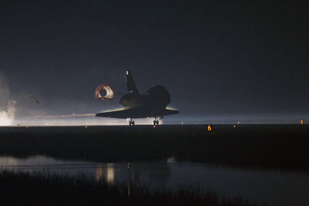 STS135-S-251 (21 July 2011) --- Xenon lights guide space shuttle Atlantis as it lands on the Shuttle Landing Facility's Runway 15 at NASA's Kennedy Space Center in Florida for the final time. Securing the space shuttle fleet's place in history, Atlantis marked the 26th nighttime landing of NASA's Space Shuttle Program and the 78th landing at Kennedy. Main gear touchdown was at 5:57:00 a.m. (EDT) on July 21, 2011, followed by nose gear touchdown at 5:57:20 a.m., and wheelstop at 5:57:54 a.m. Onboard are NASA astronauts Chris Ferguson, STS-135 commander; Doug Hurley, pilot; Sandy Magnus and Rex Walheim, both mission specialists. On the 37th shuttle mission to the International Space Station, STS-135 delivered more than 9,400 pounds of spare parts, equipment and supplies in the Raffaello multi-purpose logistics module that will sustain station operations for the next year. STS-135 was the 33rd and final flight for Atlantis, which has spent 307 days in space, orbited Earth 4,848 times and traveled 125,935,769 miles. Photo credit: NASA