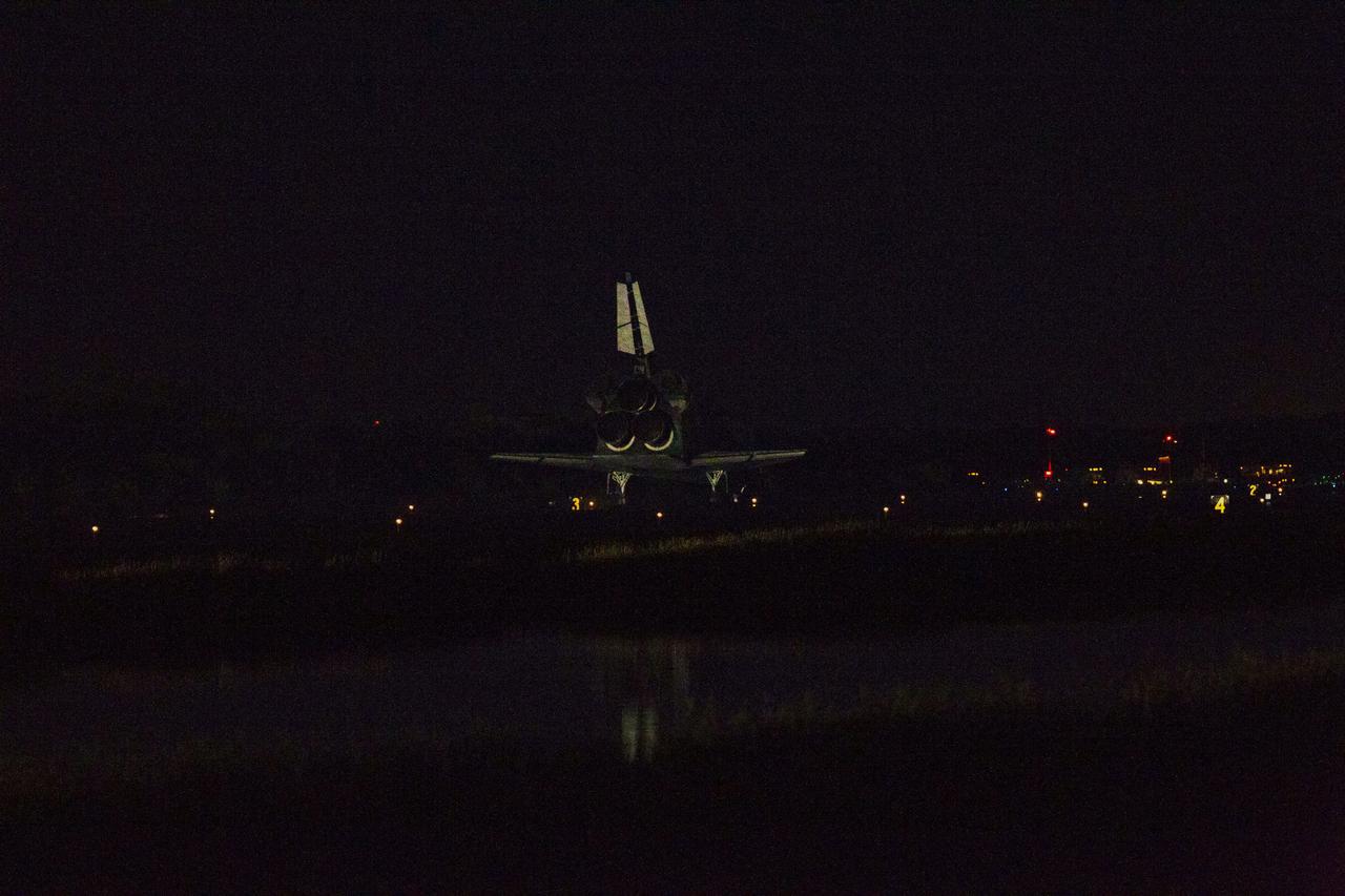 STS135-S-263 (21 July 2011) --- At the Shuttle Landing Facility at NASA's Kennedy Space Center in Florida, space shuttle Atlantis rolls to a stop on Runway 15 one final time. Securing the space shuttle fleet's place in history, Atlantis marked the 26th nighttime landing of NASA's Space Shuttle Program and the 78th landing at Kennedy. Main gear touchdown was at 5:57:00 a.m. (EDT) on July 21, 2011, followed by nose gear touchdown at 5:57:20 a.m., and wheelstop at 5:57:54 a.m. Onboard are NASA astronauts Chris Ferguson, STS-135 commander; Doug Hurley, pilot; Sandy Magnus and Rex Walheim, both mission specialists. On the 37th shuttle mission to the International Space Station, STS-135 delivered more than 9,400 pounds of spare parts, equipment and supplies in the Raffaello multi-purpose logistics module that will sustain station operations for the next year. STS-135 was the 33rd and final flight for Atlantis, which has spent 307 days in space, orbited Earth 4,848 times and traveled 125,935,769 miles. Photo credit: NASA