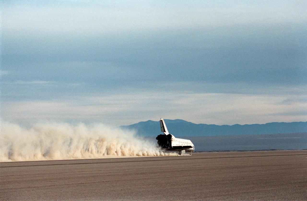STS027-S-012 (6 Dec. 1988) --- A 70mm camera records the landing of the Space Shuttle Atlantis on Rogers Dry Lake Bed near the Dryden Flight Research Facility in California. The wheels of the vehicle came to a stop at 3:36:53 p.m. (PST), marking the completion of a successful mission which involved five veteran NASA astronauts. Onboard for the four-day flight were astronauts Robert L. Gibson, Guy S. Gardner, Jerry L. Ross, Richard M. (Mike) Mullane and William M. Shepherd.