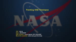 Crews paints NASA Meatball on VAB