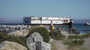 JPSS-2 Atlas V Booster Arrival, Offload and Transport to HIF