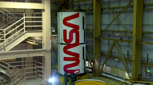 NASA Worm Logo Painting on Artemis II Boosters