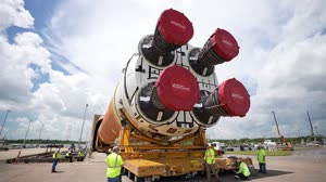 Space Launch System Core Stage for Artemis II Rocket Loaded onto Pegasus Barge