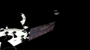 Orion views an eclipse of the Moon and Earth